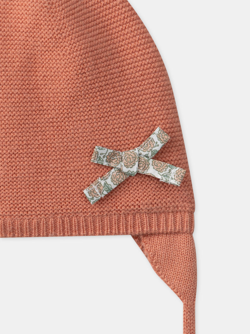 Rosa Strickmütze mit Knoten für neugeborene Mädchen