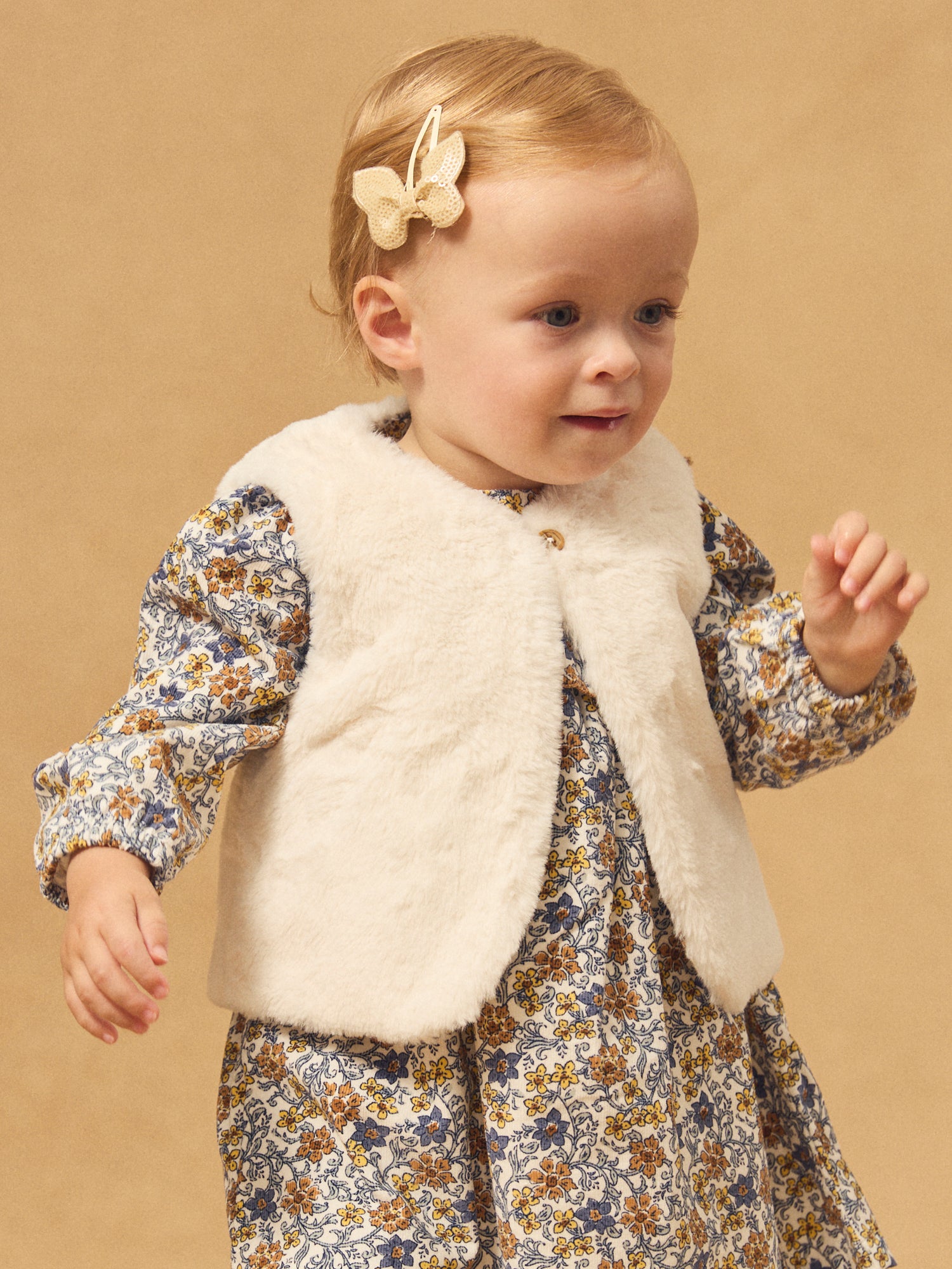 Reversibles weißes Weste aus Fell oder Floralprint für Mädchen