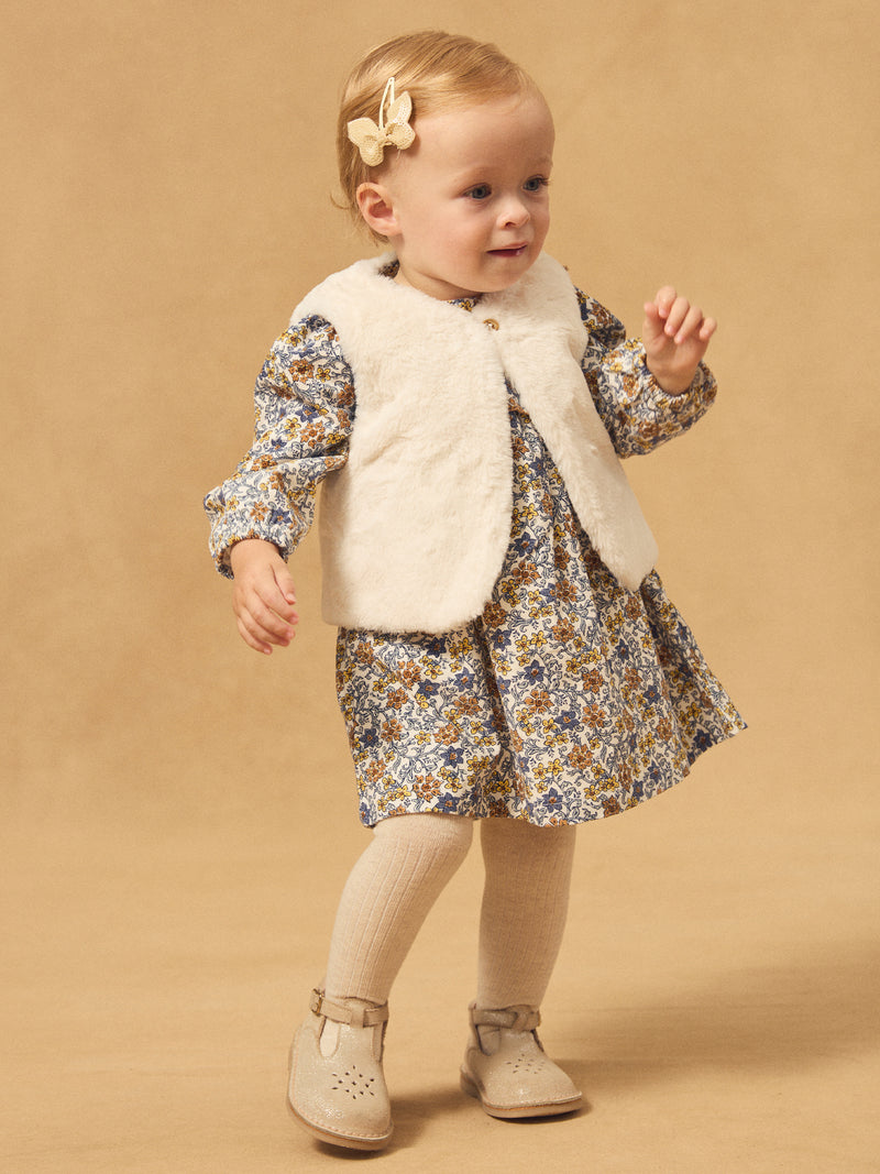 Reversibles weißes Weste aus Fell oder Floralprint für Mädchen