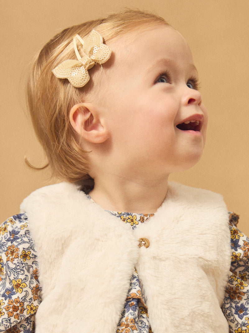 Reversibles weißes Weste aus Fell oder Floralprint für Mädchen